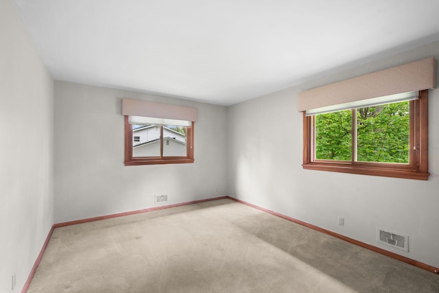 14 Overlook Rd, Dellwood, MN 55110 - carpeted spare room with healthy amount of natural light and baseboards