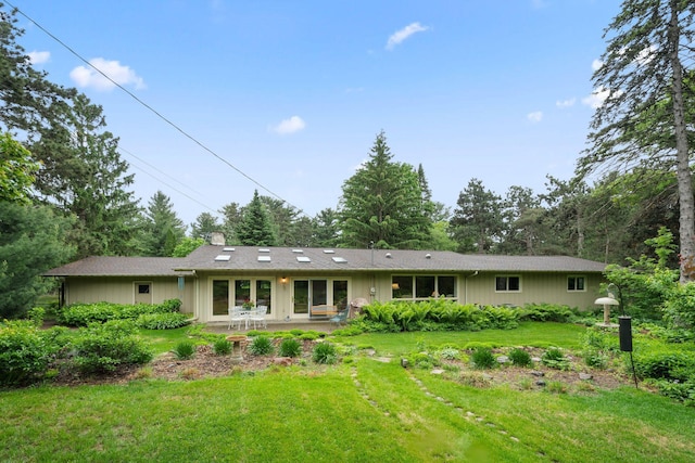 14 Overlook Rd, Dellwood, MN 55110 - rear view of house with a lawn, a chimney, and a patio area