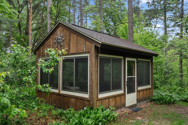 14 Overlook Rd, Dellwood, MN 55110 - view of home's exterior with roof with shingles and board and batten siding