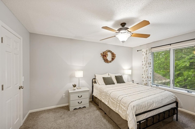 5101 201st St N, Forest Lake, MN 55025 - carpeted bedroom with a textured ceiling, baseboards, and a ceiling fan