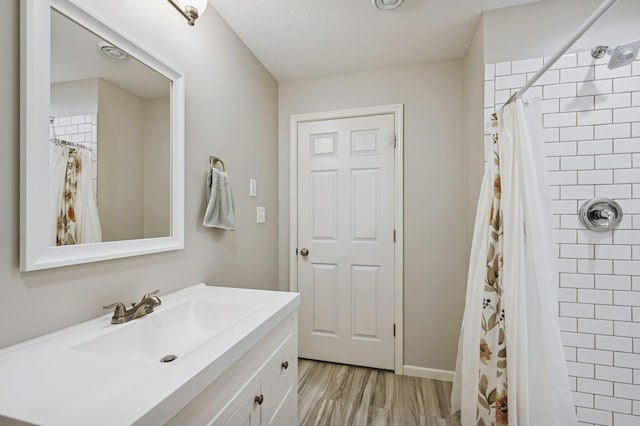 5101 201st St N, Forest Lake, MN 55025 - bathroom with vanity, a tile shower, and wood finished floors