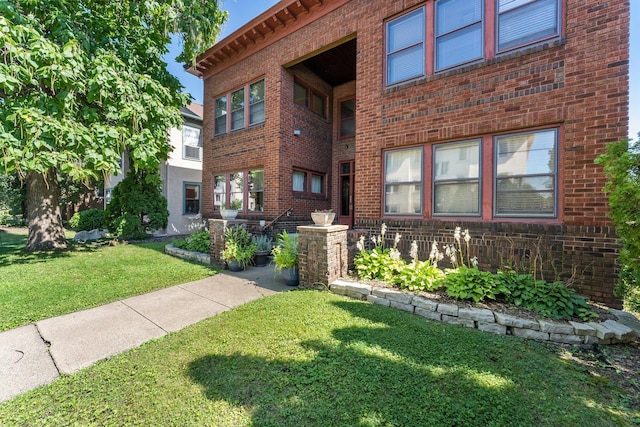 2895 James Ave S Unit 2, Minneapolis, MN 55408 - view of front of property featuring brick siding and a front lawn