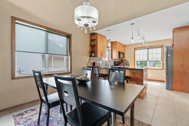 7734 Lancaster Ave NE, Otsego, MN 55301 - dining room with light tile patterned floors and baseboards