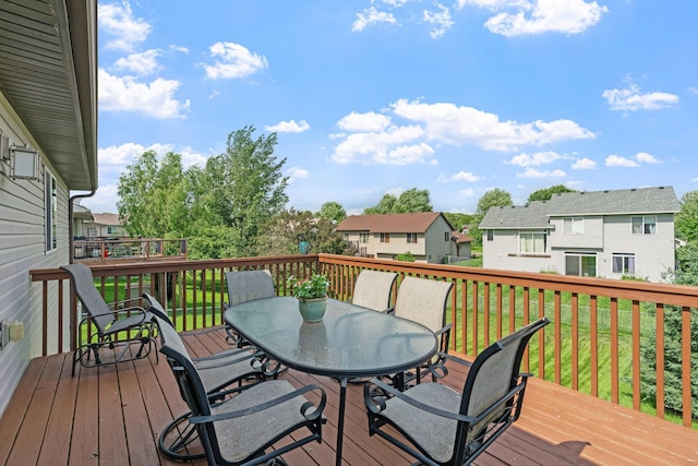 7734 Lancaster Ave NE, Otsego, MN 55301 - deck featuring outdoor dining space, a residential view, and a lawn