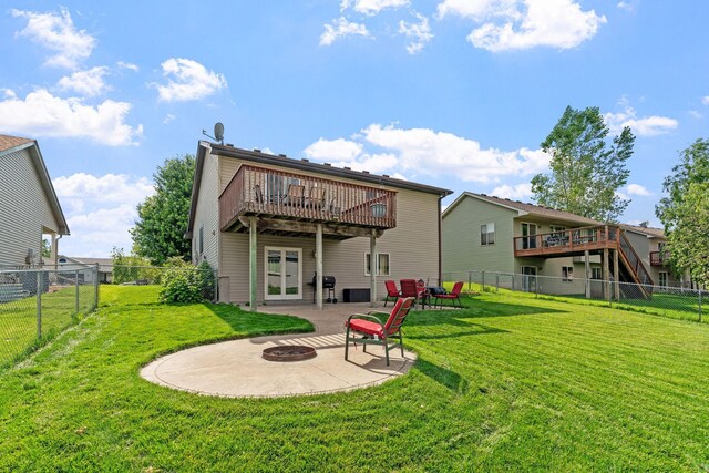 7734 Lancaster Ave NE, Otsego, MN 55301 - back of property with an outdoor fire pit, a fenced backyard, and a patio