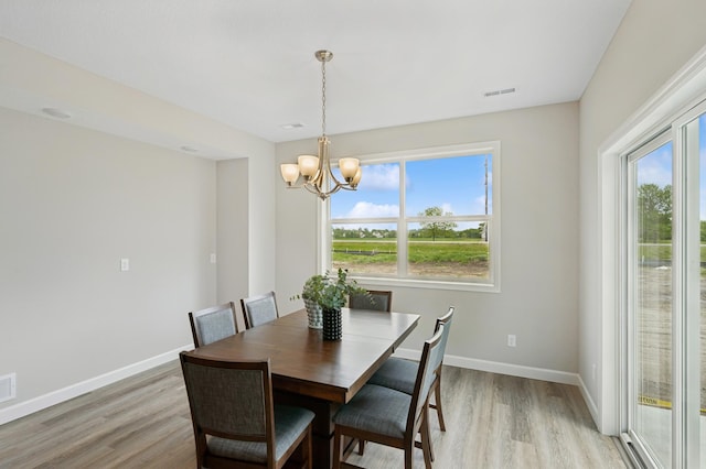 464 Whitewater Ct, Delano, MN 55328 - dining room featuring light wood-type flooring, healthy amount of natural light, and a chandelier