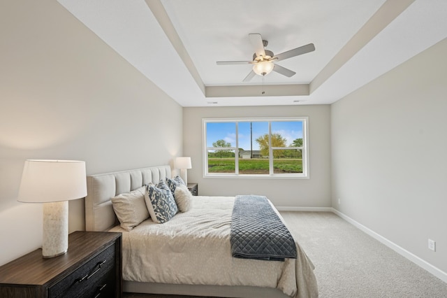 464 Whitewater Ct, Delano, MN 55328 - carpeted bedroom with a raised ceiling, baseboards, and ceiling fan