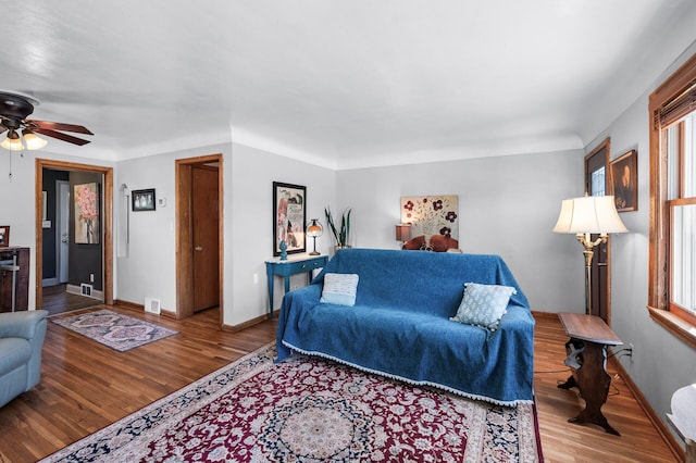 1551 Margaret St, Saint Paul, MN 55106 - living room featuring wood finished floors, ceiling fan, and baseboards
