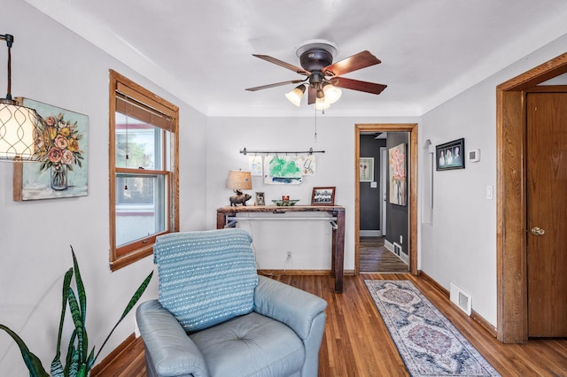 1551 Margaret St, Saint Paul, MN 55106 - living area featuring a ceiling fan, baseboards, and wood finished floors