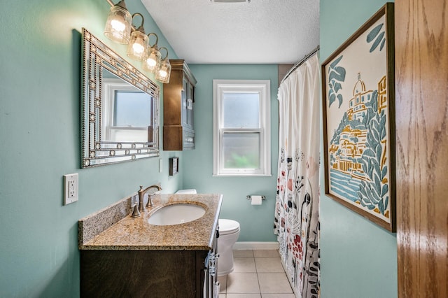 1551 Margaret St, Saint Paul, MN 55106 - full bathroom featuring toilet, vanity, tile patterned flooring, baseboards, and a textured ceiling