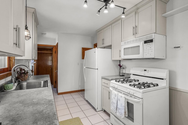 1551 Margaret St, Saint Paul, MN 55106 - kitchen with white appliances, a sink, light tile patterned floors, and light countertops