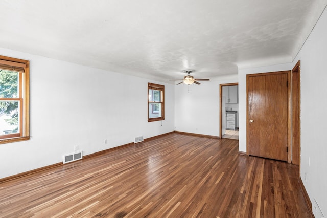1551 Margaret St, Saint Paul, MN 55106 - unfurnished bedroom featuring wood finished floors, baseboards, and a ceiling fan
