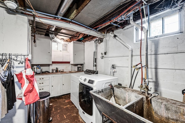 1551 Margaret St, Saint Paul, MN 55106 - washroom featuring washer and clothes dryer and cabinet space