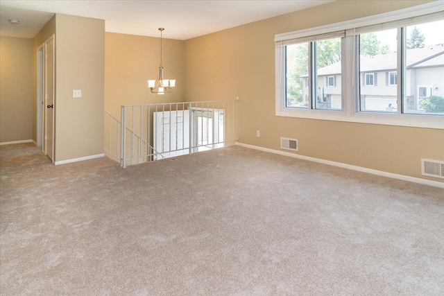 10326 Balsam Ln, Eden Prairie, MN 55347 - unfurnished room with a chandelier and carpet floors