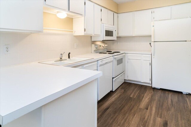 10326 Balsam Ln, Eden Prairie, MN 55347 - kitchen featuring white appliances, tasteful backsplash, light countertops, dark wood finished floors, and white cabinetry