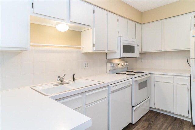 10326 Balsam Ln, Eden Prairie, MN 55347 - kitchen with white appliances, decorative backsplash, light countertops, and dark wood-type flooring