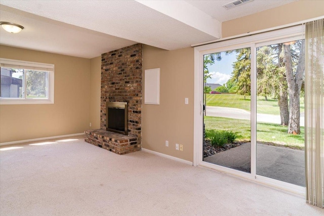 10326 Balsam Ln, Eden Prairie, MN 55347 - unfurnished living room featuring carpet flooring and a fireplace