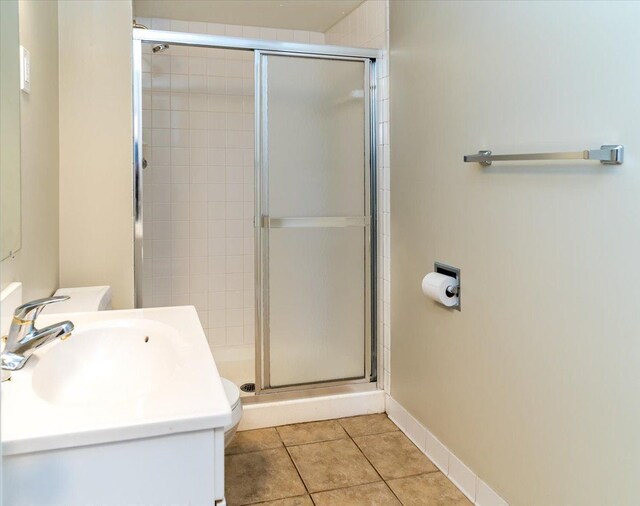 10326 Balsam Ln, Eden Prairie, MN 55347 - bathroom with a shower stall, tile patterned flooring, and vanity