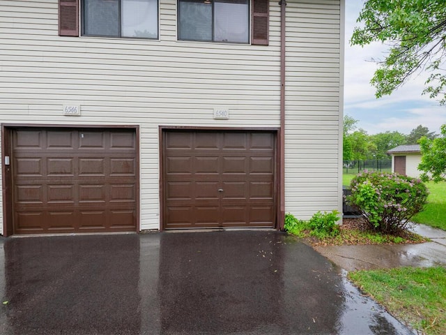 6540 84th Ct N, Brooklyn Park, MN 55445 - garage featuring driveway