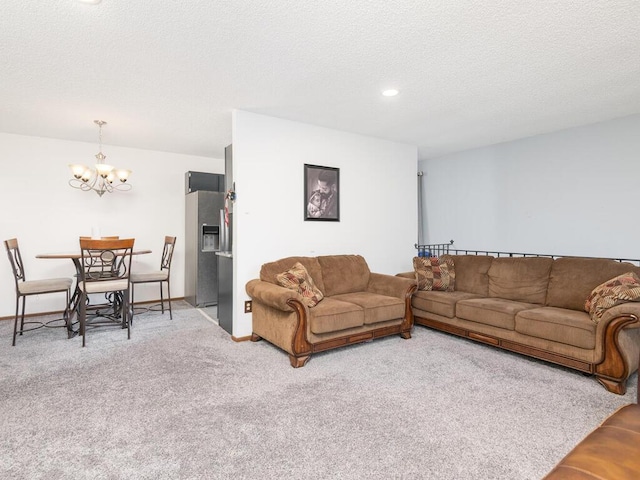 6540 84th Ct N, Brooklyn Park, MN 55445 - living room featuring a chandelier, carpet floors, and a textured ceiling