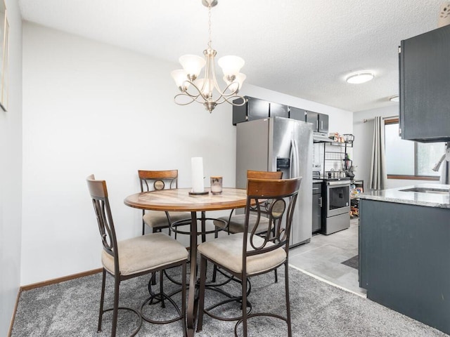 6540 84th Ct N, Brooklyn Park, MN 55445 - dining area with a chandelier and a textured ceiling