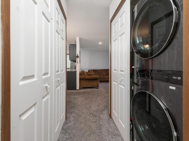 6540 84th Ct N, Brooklyn Park, MN 55445 - laundry room with stacked washer / drying machine, carpet flooring, and recessed lighting
