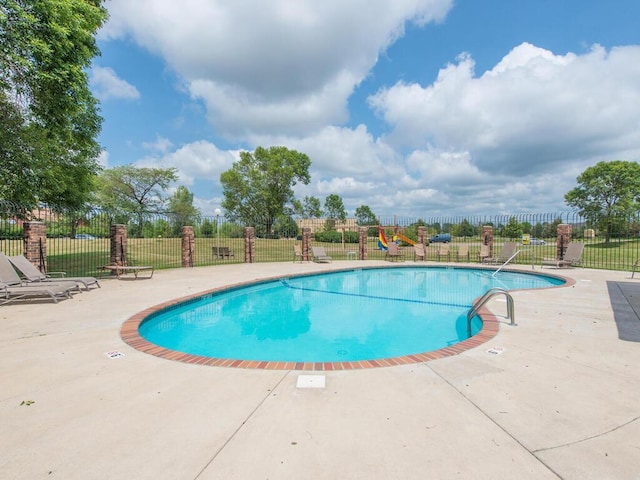 6540 84th Ct N, Brooklyn Park, MN 55445 - community pool with a patio area