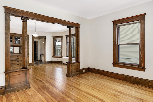 2227 Garfield Ave, Minneapolis, MN 55405 - unfurnished room featuring light wood finished floors, radiator heating unit, and baseboards