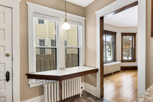 2227 Garfield Ave, Minneapolis, MN 55405 - hallway with radiator heating unit and baseboards