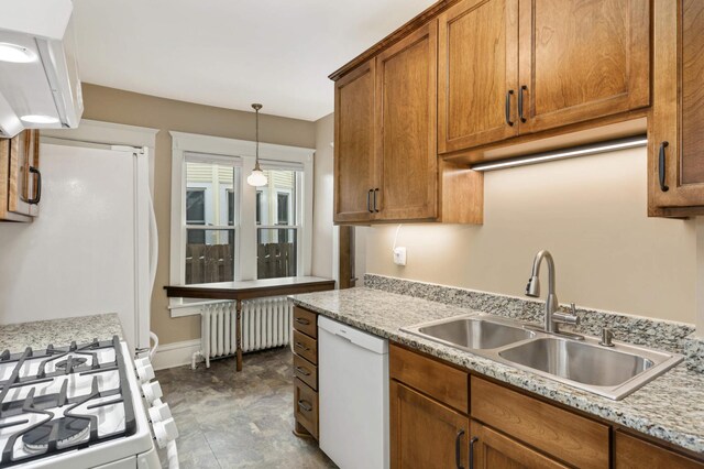 2227 Garfield Ave, Minneapolis, MN 55405 - kitchen featuring white appliances, radiator heating unit, a sink, brown cabinets, and hanging light fixtures