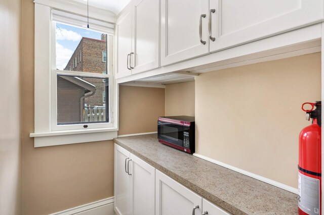 2227 Garfield Ave, Minneapolis, MN 55405 - kitchen with white cabinets and light countertops