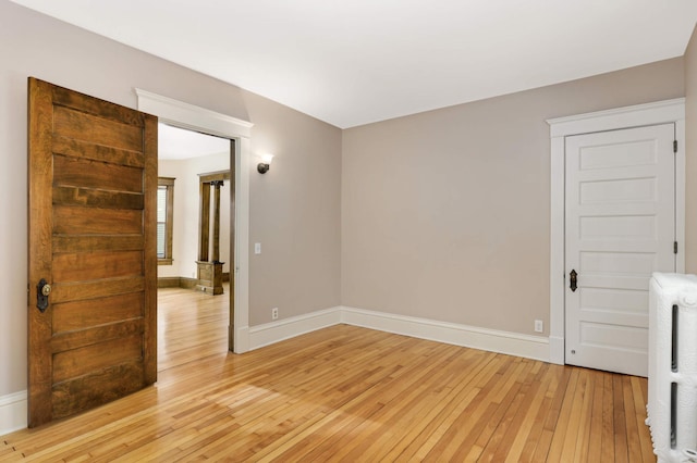 2227 Garfield Ave, Minneapolis, MN 55405 - unfurnished room featuring light wood-type flooring and baseboards