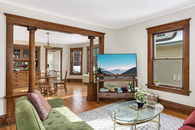 2227 Garfield Ave, Minneapolis, MN 55405 - living room featuring wood finished floors, baseboards, and healthy amount of natural light