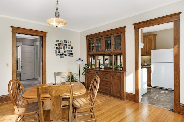 2227 Garfield Ave, Minneapolis, MN 55405 - dining space with light wood finished floors and crown molding