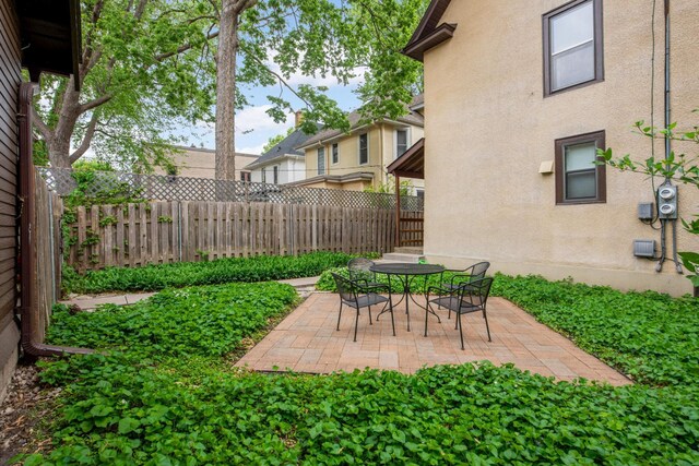 2227 Garfield Ave, Minneapolis, MN 55405 - fenced backyard with a patio area