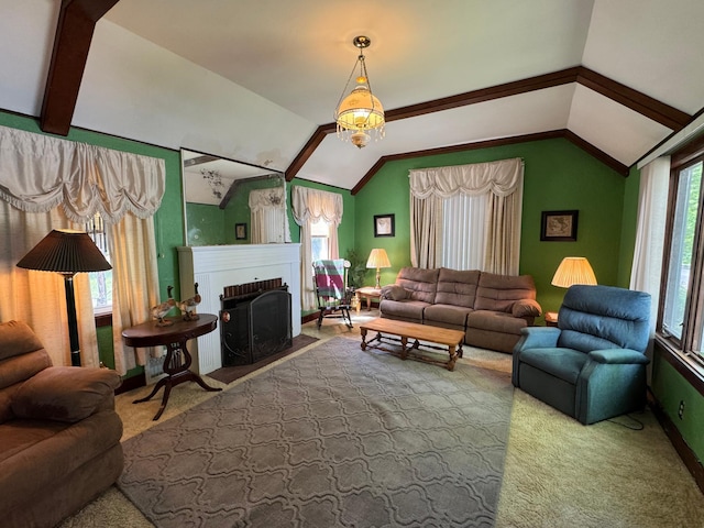 205 Lake Park Blvd, Fairmont, MN 56031 - carpeted living room featuring lofted ceiling, a brick fireplace, and a chandelier