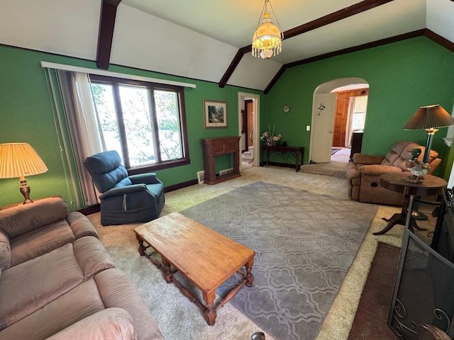 205 Lake Park Blvd, Fairmont, MN 56031 - carpeted living area featuring lofted ceiling, plenty of natural light, arched walkways, and baseboards