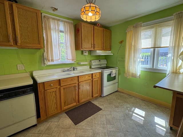205 Lake Park Blvd, Fairmont, MN 56031 - kitchen featuring white electric stove, stove, under cabinet range hood, and brown cabinetry