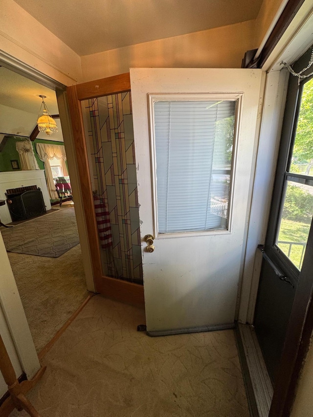 205 Lake Park Blvd, Fairmont, MN 56031 - doorway to outside featuring carpet flooring
