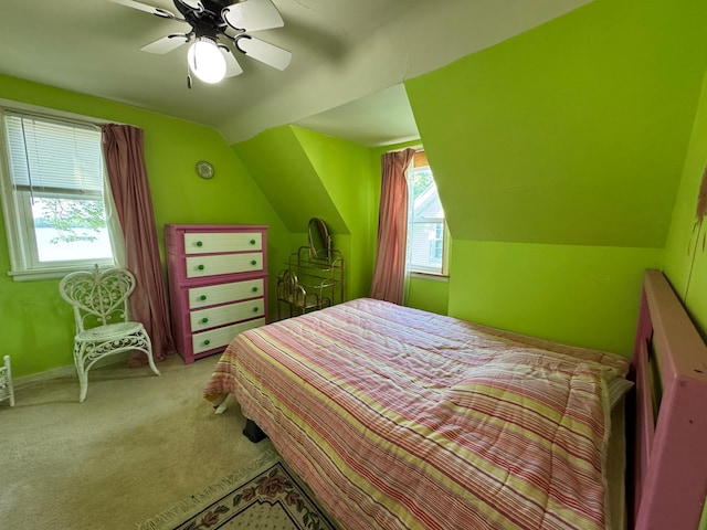 205 Lake Park Blvd, Fairmont, MN 56031 - carpeted bedroom featuring multiple windows, lofted ceiling, and a ceiling fan