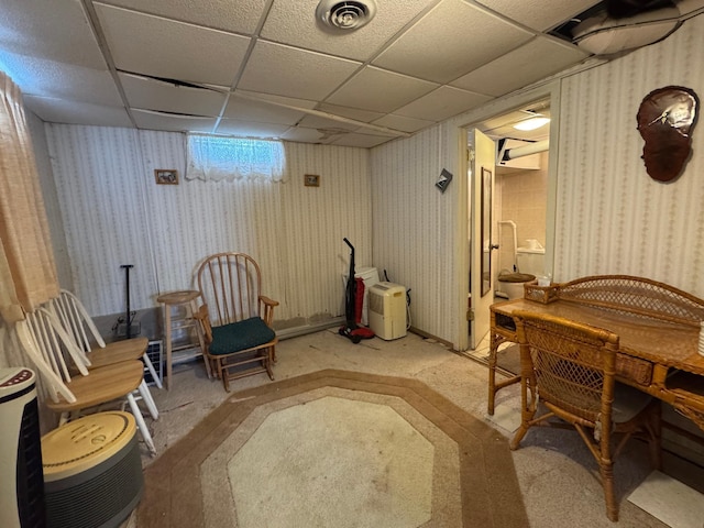 205 Lake Park Blvd, Fairmont, MN 56031 - living area with wallpapered walls, a paneled ceiling, and baseboards