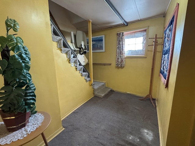 205 Lake Park Blvd, Fairmont, MN 56031 - below grade area featuring carpet, stairway, and baseboards