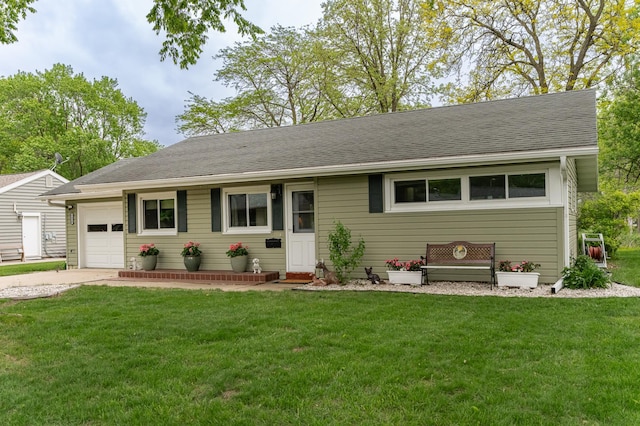 ranch-style house with an attached garage, a front yard, driveway, and roof with shingles