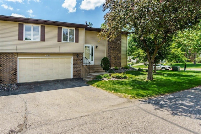 10350 Balsam Ln, Eden Prairie, MN 55347 - raised ranch featuring brick siding, a garage, driveway, a front yard, and entry steps