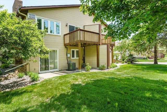 10350 Balsam Ln, Eden Prairie, MN 55347 - rear view of property featuring a lawn, a deck, and a chimney