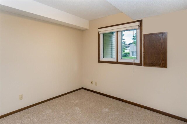 10350 Balsam Ln, Eden Prairie, MN 55347 - unfurnished room featuring carpet and baseboards