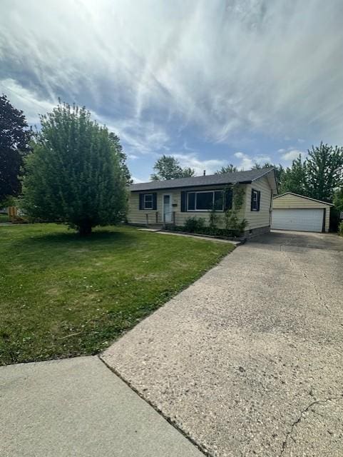 view of front of property featuring crawl space, a front yard, an outbuilding, and a detached garage