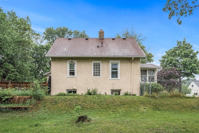 48 Jessamine Ave E, Saint Paul, MN 55117 - back of house featuring stucco siding, a chimney, and a shingled roof