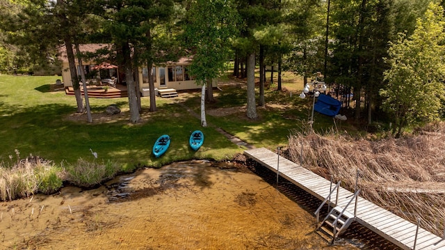 view of home's community featuring a yard and a deck