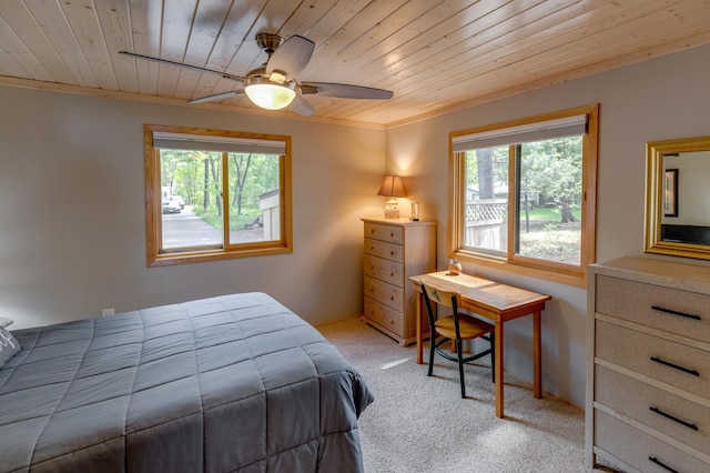 bedroom featuring wooden ceiling, light carpet, a ceiling fan, and ornamental molding